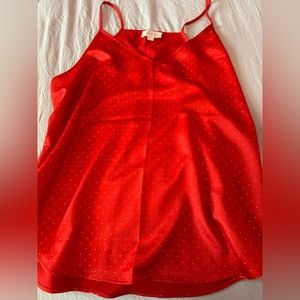 Never worn.. too small…LOFT Festive red, silky cami w tiny gold dots